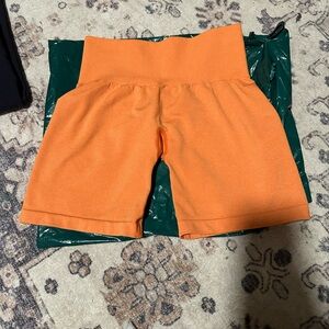 NVGTN High Waist Women Shorts - Orange